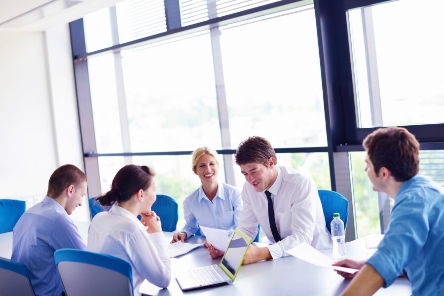 group-of-happy-young-business-people-in-a-meeting-at-office