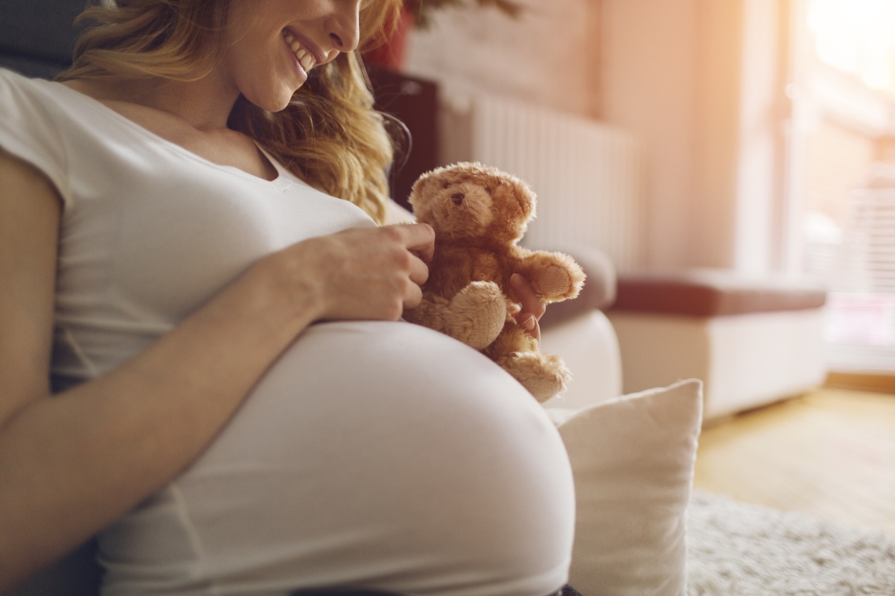 pregnant-woman-holding-teddy-bear